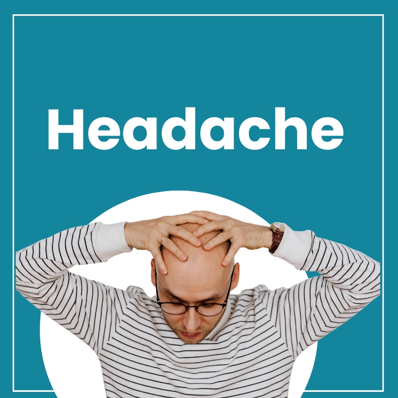 A man wearing a black and white striped T-shirt is holding his head because of pain, and the text on the screen says ‘Headache
